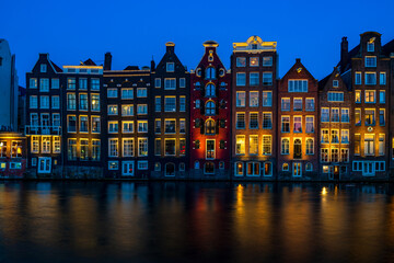 Typical Dutch houses in Amsterdam at dusk. Holland