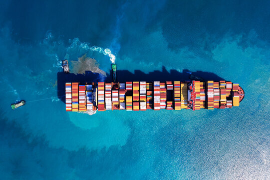 Aerial top view container ship full load container for logistics import export, shipping or transportation concept.