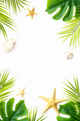 Fototapeta na wymiar Summer flat lay background. Tropical leaves, palm leaves and sea shells on white background.