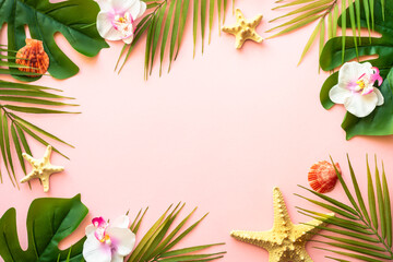 Summer flat lay on pink background. Tropical leaves, palm leaves, flowers and sea shells.