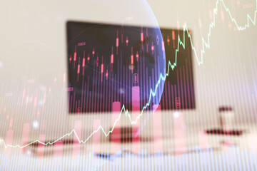Multi exposure of abstract financial graph with world map on modern computer background, financial and trading concept