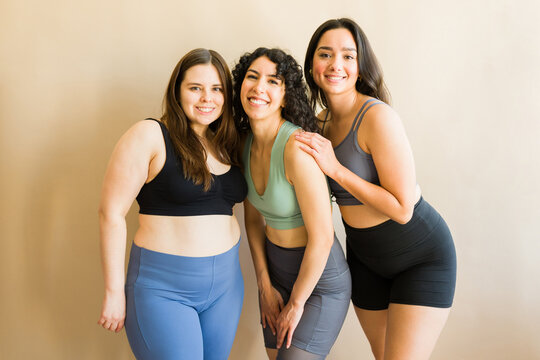 Fitness women with plus size bodies preparing for a workout