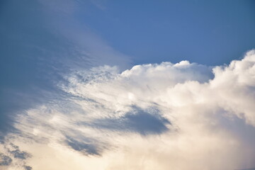 cloud spreading on bright sky in sunny day 