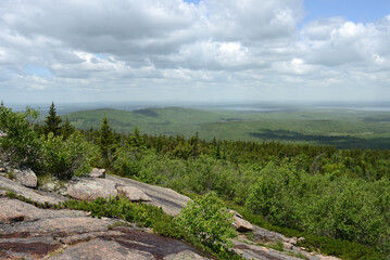 Fototapeta na wymiar Views of Cadillac Mountain showing granite, woodlands, lakes, and ponds. Acadia National Park. State of Maine. USA