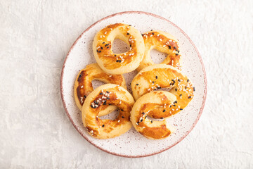 Homemade asian salted cookies on gray concrete, top view.