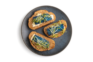 Bread sandwiches with blue lavender cheese and mustard microgreen isolated on white, top view, close up.