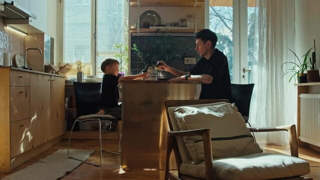 Father and son play with toys. Parents and children.