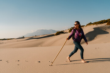 Woman on dunes of Patara Beach Turkey.