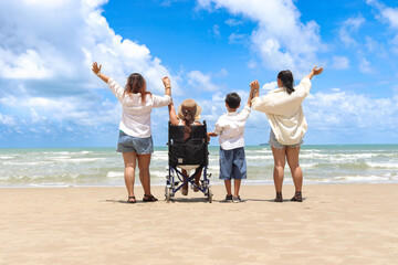 Happy disabled senior elderly woman in wheelchair spending time together with her family on...
