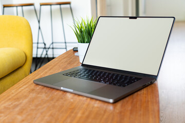 laptop lying on the table. Clear screen mockup