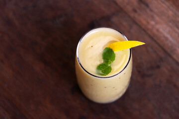 Healthy  tropical fruits pineapple, mango, banana smoothie with chia seed. Yellow superfood smoothie.