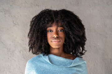 Portrait of happy african american woman - Curly hair cuban woman  with nose piercings posing in...
