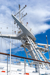 white antennas, radar and other communication and navigation equipment on ship