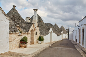 Fototapeta na wymiar Alberobello, Puglia, Italy: Cityscape over the traditional roofs of the Trulli