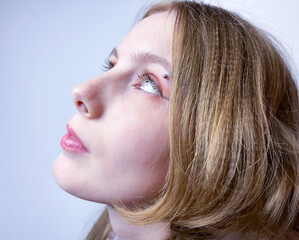 a young girl in a black leather jacket