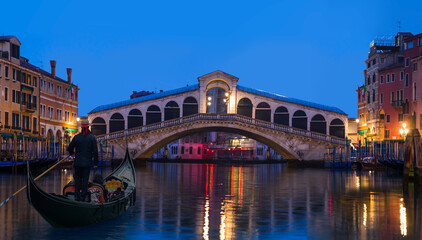 Fototapeta na wymiar Gondola near Rialto Bridge in Venice, Italy