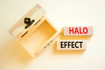 Halo effect and psychological symbol. Concept words Halo effect on beautiful wooden block. Beautiful white background. Empty wooden chest. Business psychological and Halo effect concept. Copy space.