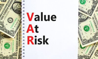 VAR Value at risk symbol. Concept words VAR Value at risk on beautiful white note. Dollar bills....
