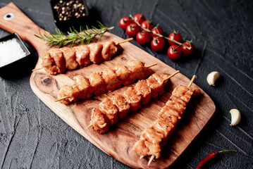 raw turkey skewers
on a stone background