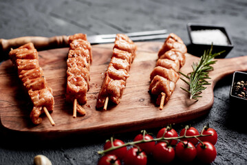 raw turkey skewers
on a stone background