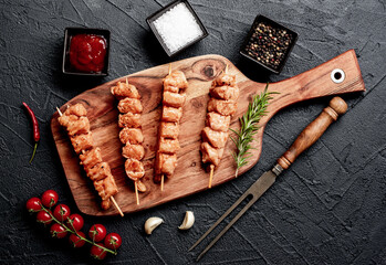 raw turkey skewers
on a stone background