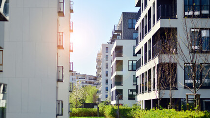 Modern apartment buildings on a sunny day with a blue sky. Facade of a modern apartment building. Contemporary residential building exterior in the daylight. 