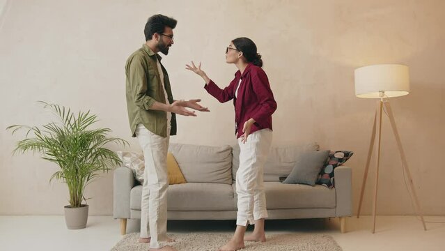 Unhappy indian couple having argument at home Generative AI