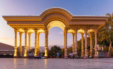 Fototapeta premium Park Kamal Khudzhandi Entrance in Khujand with beautiful evening illumnation. Tajikistan.