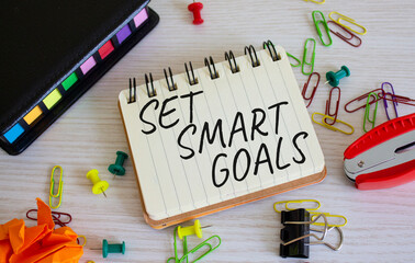Set smart goals symbol. Concept words Set smart goals on white notebook. Beautiful wooden background. Business and Set smart goals concept. Copy space.