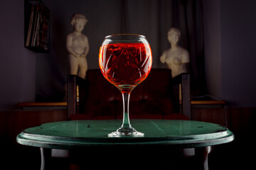 red drink on green table