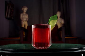 red drink on green table
