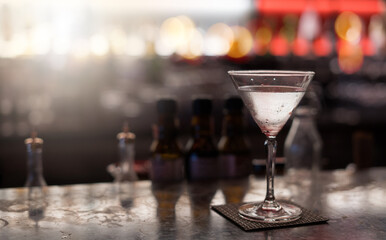 cocktail in martini glass. Night club background
