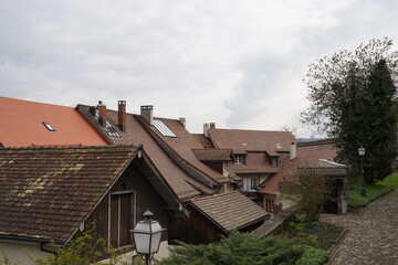 Rooftops of the old city of Laufenburg in Germany. The roofing tiles are of various shades of red and brown. Suitable as a background with a lot of copy space. 