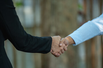 handshake after partnership meeting success business contract deal. Handshaking for good deal...