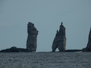 Risin and Kellingin, a pair of basalt rock formations in Faroe Islands, off the coast of Eysturoy...