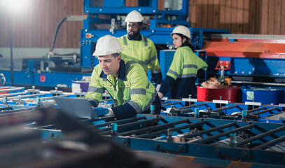 Before assembling, modifying sheet metallic components, skilled metal roofing mechanics review the...