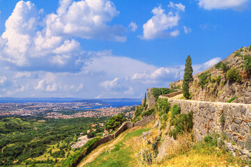 Fototapeta na wymiar Summer landscape - view of the Klis Fortress and the city of Split, on the Adriatic coast of Croatia