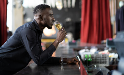 Portrait of confident African American businessman at nightclub.