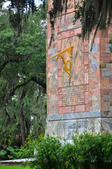 The golden sun dial clock adorning the side of the 'singing' Bok Tower in Lake Wales in Florida. 