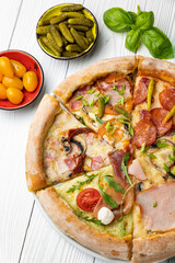 delicious pizza on a white wooden table. close-up
