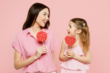 Happy excited fun cool woman wear casual clothes with child kid girl 6-7 years old. Mother daughter...