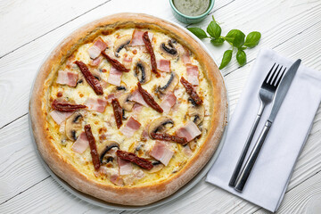 delicious pizza on a white wooden table. close-up
