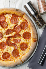 delicious pizza on a white wooden table. close-up
