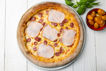 delicious pizza on a white wooden table. close-up
