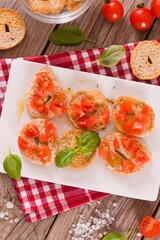 Friselle with cherry tomatoes and basil. 