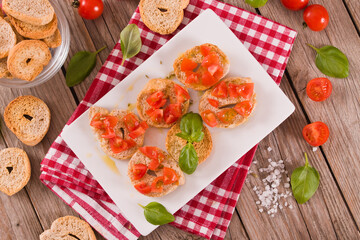 Friselle with cherry tomatoes and basil. 