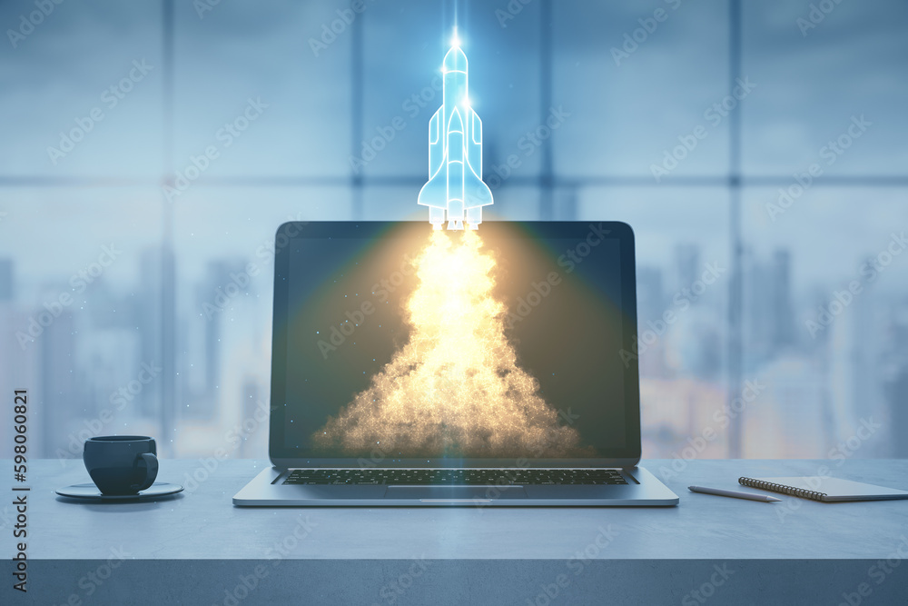 Poster close up of modern workplace with laptop and launching rocker hologram, coffee cup and window with b