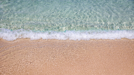 ocean meets the beach sand