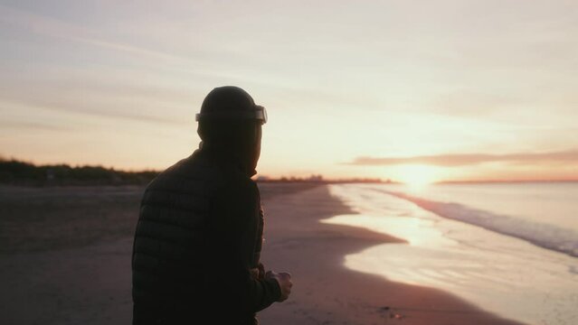 training of a boxer by the beach at sunrise