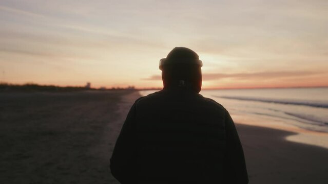 training of a boxer by the beach at sunrise